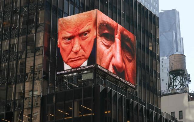 Images of US President Donald Trump and the late convicted sex offender Jeffrey Epstein are displayed on a digital billboard in Times Square in New York April 8, 2026. The billboard was paid for by The Lincoln Project, a political action committee founded by moderate Republicans who oppose Trump. (Photo by TIMOTHY A. CLARY / AFP)