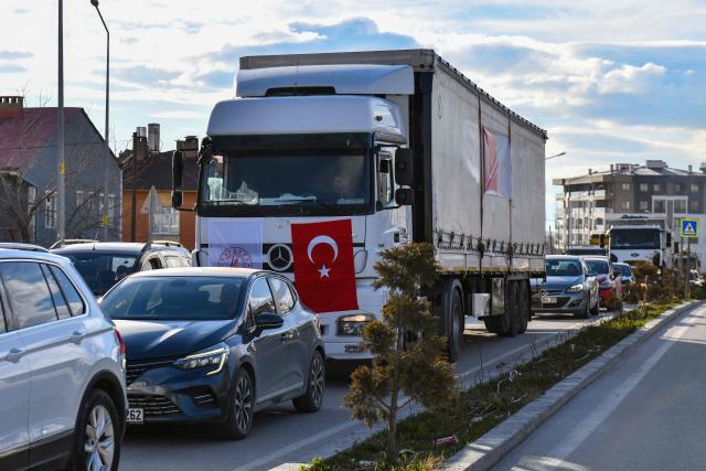 A truck bearing Turkish and Health Ministry flags and loaded with medical supplies prepared by the Turkish Health Ministry departs for Iran in Van, north-eastern Turkey, on April 8, 2026. Three trucks loaded with humanitarian aid are scheduled to enter Iran on April 8, 2026 from Turkey, announced Turkish Health Minister Kemal Memisoglu. (Photo by Ali IHSAN OZTURK / AFP)