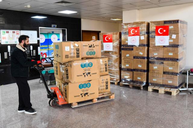 A worker moves a pallet of medical cardboard boxes as Turkish Health Ministry plans to send medical supplies in Iran in Van, north-eastern Turkey, on April 8, 2026. Three trucks loaded with humanitarian aid are scheduled to enter Iran on April 8, 2026 from Turkey, announced Turkish Health Minister Kemal Memisoglu. (Photo by Ali IHSAN OZTURK / AFP)