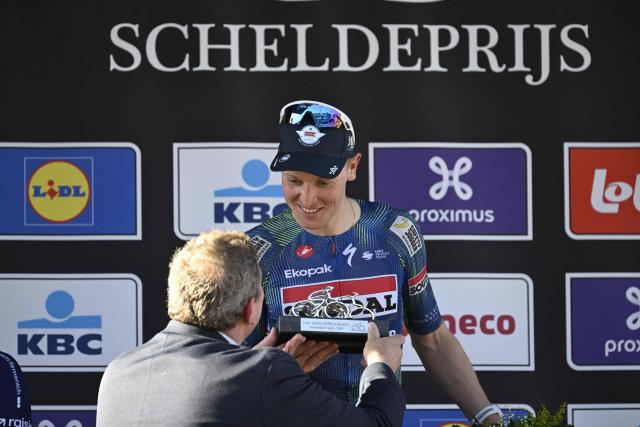 Belgian cyclist Tim Merlier of Soudal Quick-Step celebrates on the podium after winning the Scheldeprijs one-day cycling race, a 205.2km race from Terneuzen to Schoten, in Schoten on April 8, 2026. (Photo by Tom Goyvaerts / Belga / AFP) / Belgium OUT