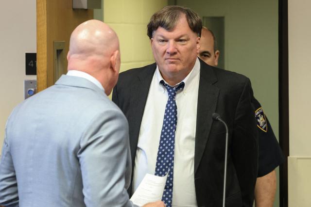 Rex Heuermann (C) pleads guilty in connection with the Gilgo Beach serial killings during a hearing at Suffolk County Court in Riverhead, New York on April 8, 2026. The Gilgo Beach serial killings refer to a series of murders discovered on Long Island in 2010–2011, with Rex Heuermann arrested in 2023 and charged in several of the killings. (Photo by James Carbone / POOL / AFP)