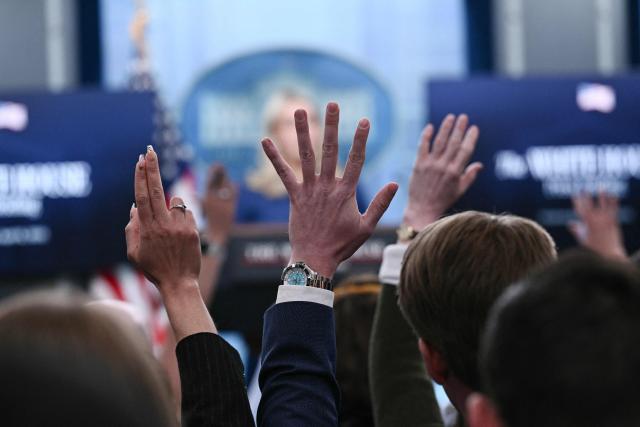 Reporters raise their hands to ask questions as White House Press Secretary Karoline Leavitt speaks during a press briefing in the Brady Briefing Room of the White House in Washington, DC, on April 8, 2026. (Photo by Brendan SMIALOWSKI / AFP)