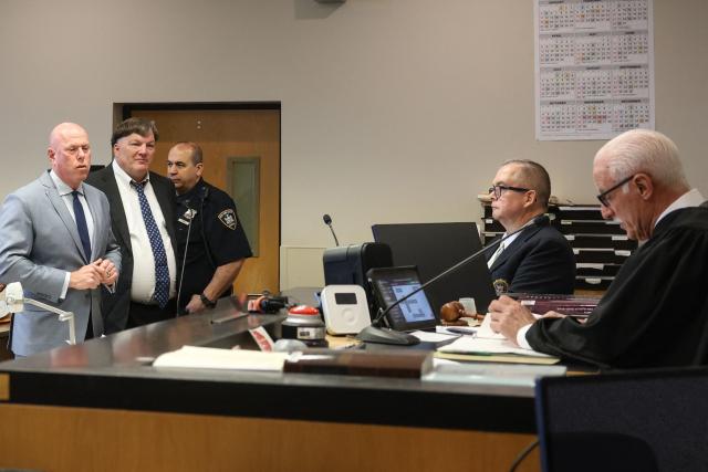 Rex Heuermann (2L) pleads guilty in connection with the Gilgo Beach serial killings during a hearing at Suffolk County Court in Riverhead, New York on April 8, 2026. The Gilgo Beach serial killings refer to a series of murders discovered on Long Island in 2010–2011, with Rex Heuermann arrested in 2023 and charged in several of the killings. (Photo by James Carbone / POOL / AFP)