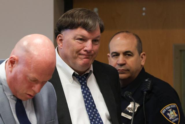 Rex Heuermann (C) pleads guilty in connection with the Gilgo Beach serial killings during a hearing at Suffolk County Court in Riverhead, New York on April 8, 2026. The Gilgo Beach serial killings refer to a series of murders discovered on Long Island in 2010–2011, with Rex Heuermann arrested in 2023 and charged in several of the killings. (Photo by James Carbone / POOL / AFP)