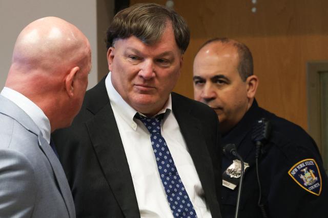 Rex Heuermann (C) pleads guilty in connection with the Gilgo Beach serial killings during a hearing at Suffolk County Court in Riverhead, New York on April 8, 2026. The Gilgo Beach serial killings refer to a series of murders discovered on Long Island in 2010–2011, with Rex Heuermann arrested in 2023 and charged in several of the killings. (Photo by James Carbone / POOL / AFP)