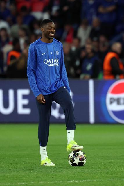 Paris Saint-Germain's French forward #10 Ousmane Dembele warms up ahead of the UEFA Champions League quarter-final first leg football match between Paris Saint-Germain (PSG) and Liverpool FC at the Parc des Princes stadium in Paris on April 8, 2026. (Photo by Anne-Christine POUJOULAT / AFP)