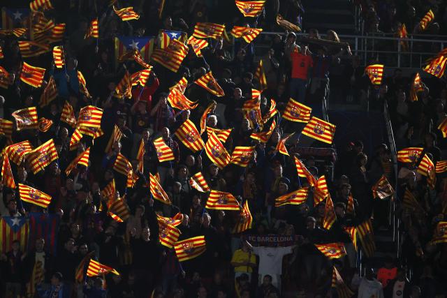 Barcelona's supporters wave flags prior the UEFA Champions League quarter final first leg football match between FC Barcelona and Club Atletico de Madrid at Camp Nou Stadium in Barcelona on April 8, 2026. (Photo by Josep LAGO / AFP)