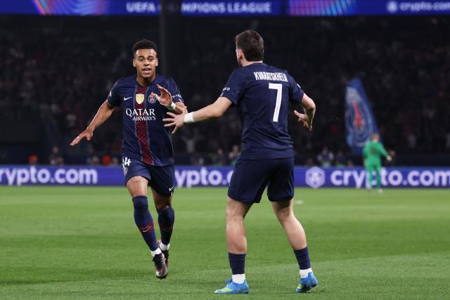 Paris Saint-Germain's French midfielder #14 Desire Doue (L) celebrates after scoring the opening goal during the UEFA Champions League quarter-final first leg football match between Paris Saint-Germain (PSG) and Liverpool FC at the Parc des Princes stadium in Paris on April 8, 2026. (Photo by FRANCK FIFE / AFP)