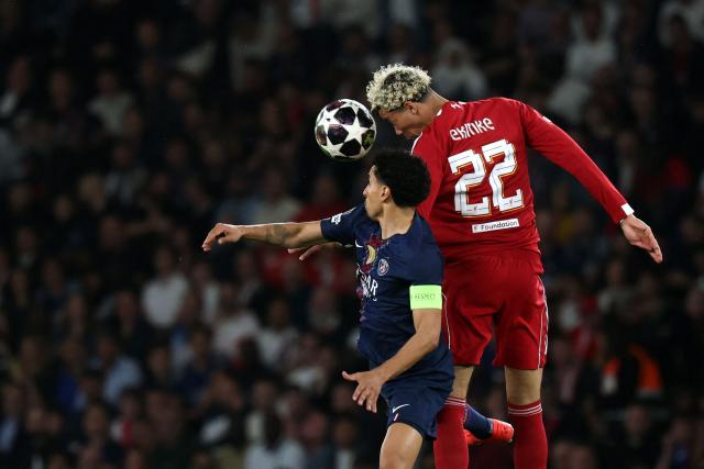 Paris Saint-Germain's Brazilian defender #05 Marquinhos (L) fights for the ball with Liverpool's French striker #22 Hugo Ekitike during the UEFA Champions League quarter-final first leg football match between Paris Saint-Germain (PSG) and Liverpool FC at the Parc des Princes stadium in Paris on April 8, 2026. (Photo by Anne-Christine POUJOULAT / AFP)