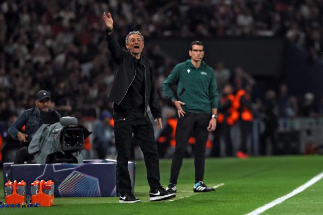 Paris Saint-Germain's Spanish headcoach Luis Enrique gestures during the UEFA Champions League quarter-final first leg football match between Paris Saint-Germain (PSG) and Liverpool FC at the Parc des Princes stadium in Paris on April 8, 2026. (Photo by Anne-Christine POUJOULAT / AFP)