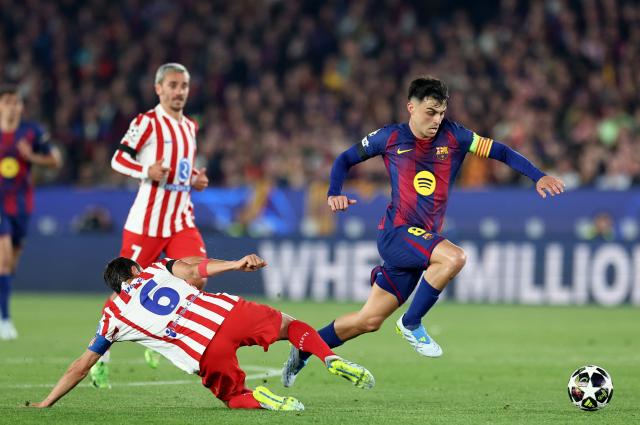 Barcelona's Spanish midfielder #08 Pedri fights for the ball with Atletico Madrid's Spanish midfielder #06 Koke during the UEFA Champions League quarter final first leg football match between FC Barcelona and Club Atletico de Madrid at Camp Nou Stadium in Barcelona on April 8, 2026. (Photo by Josep LAGO / AFP)