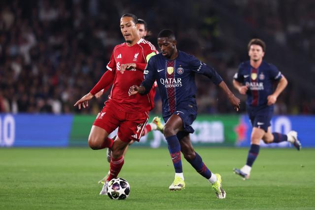 Paris Saint-Germain's French forward #10 Ousmane Dembele (C) fights for the ball with Liverpool's Dutch defender #04 Virgil van Dijk (L)  during the UEFA Champions League quarter-final first leg football match between Paris Saint-Germain (PSG) and Liverpool FC at the Parc des Princes stadium in Paris on April 8, 2026. (Photo by FRANCK FIFE / AFP)