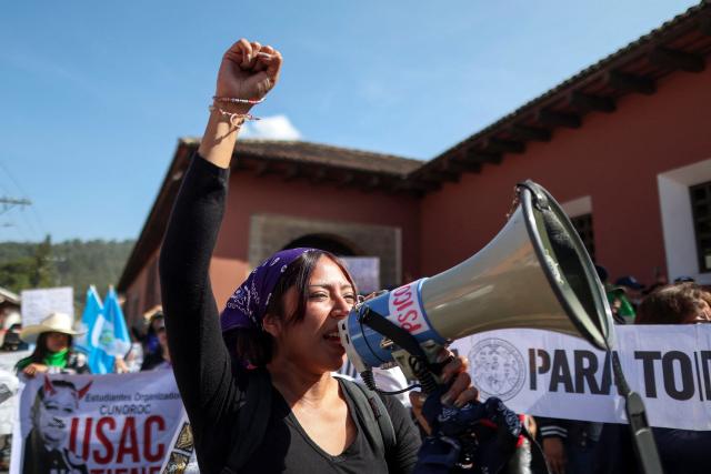 A protester denouncing an allegedly illegal election shouts slogans outside the venue where authorities of the public University of San Carlos meet to appoint their rector, in Antigua, Guatemala, on April 8, 2026. The reelection of the rector of Guatemala's sole public university ended in gunfire and unrest outside a luxury hotel where the vote was held, which the OAS described as a "tainted process." (Photo by Christian Gutierrez / AFP)