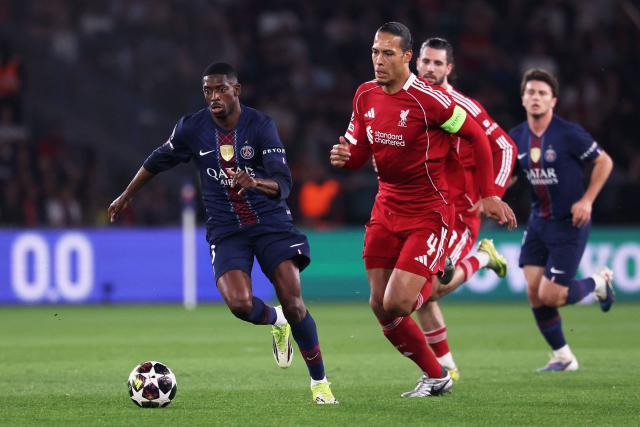 Paris Saint-Germain's French forward #10 Ousmane Dembele (L) fights for the ball with Liverpool's Dutch defender #04 Virgil van Dijk (R)  during the UEFA Champions League quarter-final first leg football match between Paris Saint-Germain (PSG) and Liverpool FC at the Parc des Princes stadium in Paris on April 8, 2026. (Photo by FRANCK FIFE / AFP)