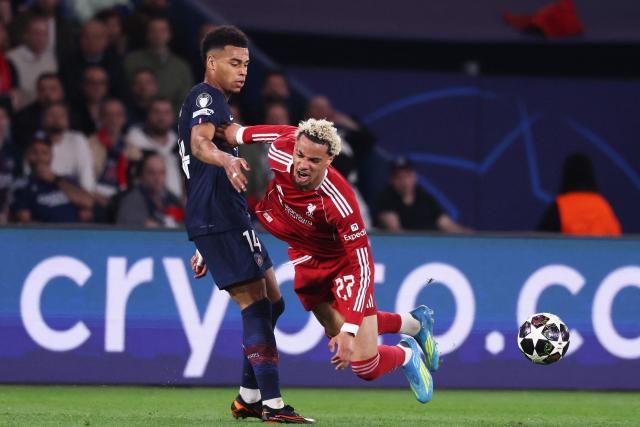 Paris Saint-Germain's French midfielder #14 Desire Doue (L) fights for the ball with Liverpool's French striker #22 Hugo Ekitike  during the UEFA Champions League quarter-final first leg football match between Paris Saint-Germain (PSG) and Liverpool FC at the Parc des Princes stadium in Paris on April 8, 2026. (Photo by FRANCK FIFE / AFP)