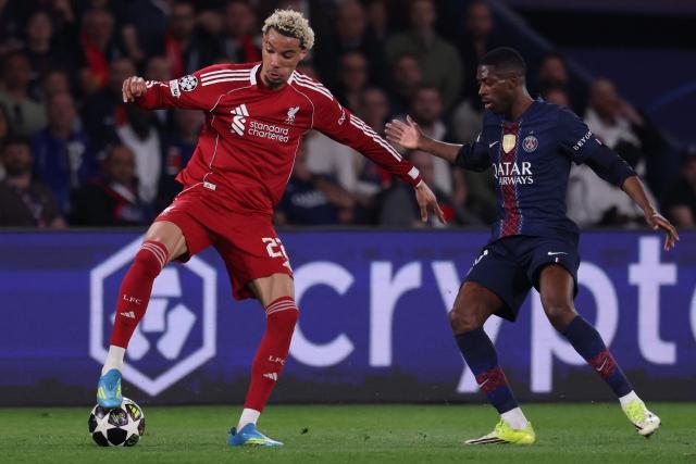 Liverpool's French striker #22 Hugo Ekitike (L) fights for the ball with Paris Saint-Germain's French forward #10 Ousmane Dembele  during the UEFA Champions League quarter-final first leg football match between Paris Saint-Germain (PSG) and Liverpool FC at the Parc des Princes stadium in Paris on April 8, 2026. (Photo by FRANCK FIFE / AFP)