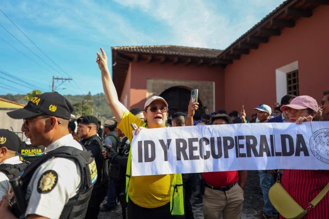 Protesters denouncing an allegedly illegal election gather outside the venue where authorities of the public University of San Carlos meet to appoint their rector, in Antigua, Guatemala, on April 8, 2026. The reelection of the rector of Guatemala's sole public university ended in gunfire and unrest outside a luxury hotel where the vote was held, which the OAS described as a "tainted process." (Photo by Christian Gutierrez / AFP)