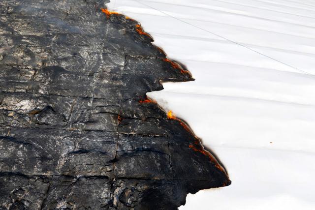 Aerial view of the roof of the Olympic Velodrome damaged by a fire in Rio de Janeiro, Brazil, on April 8, 2026. According to city authorities, the velodrome suffered limited damage and no injuries were reported, while the Rio Olympic Museum and its historical collection from the 2016 Olympic Games remained intact. (Photo by Pablo PORCIUNCULA / AFP)