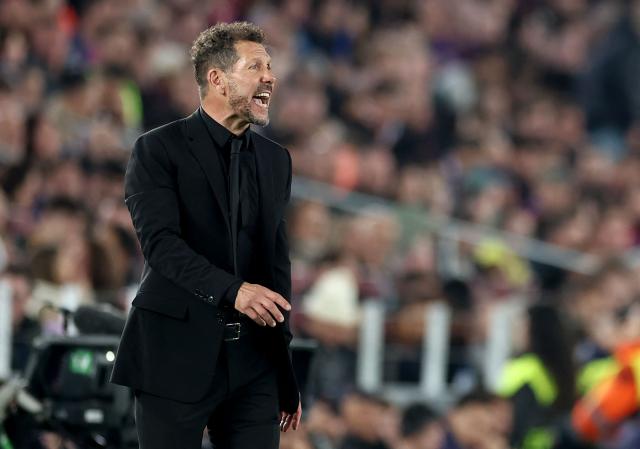 Atletico Madrid's Argentine coach Diego Simeone gestures on the touchline during the UEFA Champions League quarter final first leg football match between FC Barcelona and Club Atletico de Madrid at Camp Nou Stadium in Barcelona on April 8, 2026. (Photo by Josep LAGO / AFP)