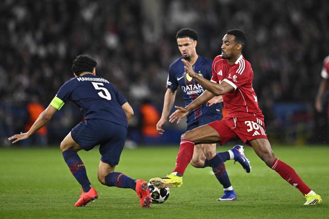 Liverpool's Dutch midfielder #38 Ryan Gravenberch (R) fights for the ball with Paris Saint-Germain's French midfielder #33 Warren Zaire-Emery (C) and Paris Saint-Germain's Brazilian defender #05 Marquinhos during the UEFA Champions League quarter-final first leg football match between Paris Saint-Germain (PSG) and Liverpool FC at the Parc des Princes stadium in Paris on April 8, 2026. (Photo by JULIEN DE ROSA / AFP)
