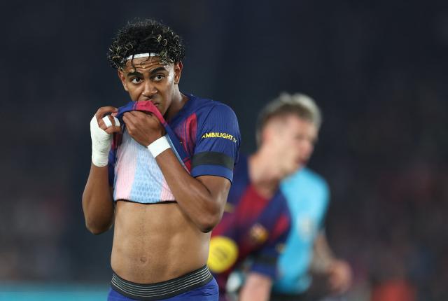 Barcelona's Spanish forward #10 Lamine Yamal looks on during the UEFA Champions League quarter final first leg football match between FC Barcelona and Club Atletico de Madrid at Camp Nou Stadium in Barcelona on April 8, 2026. (Photo by Josep LAGO / AFP)