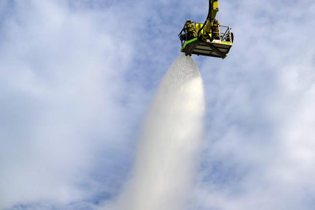 Firefighters work to extinguish a fire at the Olympic Velodrome in Rio de Janeiro, Brazil, on April 8, 2026. According to city authorities, the velodrome suffered limited damage and no injuries were reported, while the Rio Olympic Museum and its historical collection from the 2016 Olympic Games remained intact. (Photo by Pablo PORCIUNCULA / AFP)