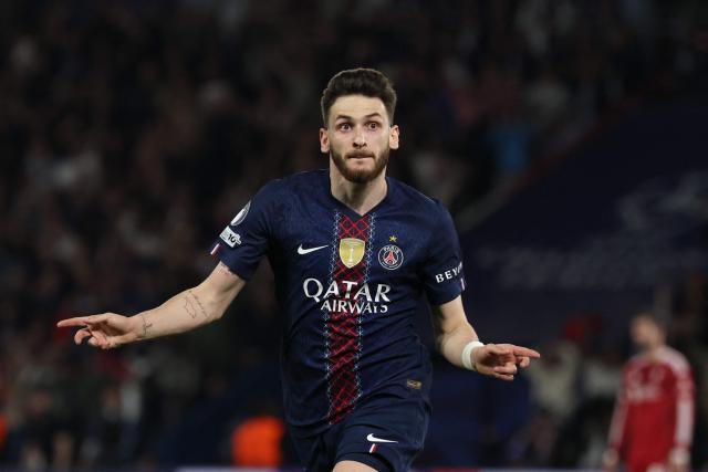 Paris Saint-Germain's Georgian forward #07 Khvicha Kvaratskhelia celebrates scoring his team's second goal during the UEFA Champions League quarter-final first leg football match between Paris Saint-Germain (PSG) and Liverpool FC at the Parc des Princes stadium in Paris on April 8, 2026. (Photo by Anne-Christine POUJOULAT / AFP)