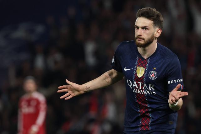 Paris Saint-Germain's Georgian forward #07 Khvicha Kvaratskhelia celebrates scoring his team's second goal during the UEFA Champions League quarter-final first leg football match between Paris Saint-Germain (PSG) and Liverpool FC at the Parc des Princes stadium in Paris on April 8, 2026. (Photo by Anne-Christine POUJOULAT / AFP)