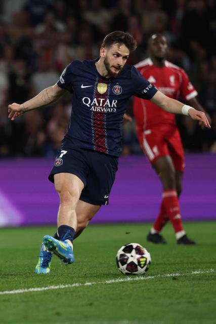 Paris Saint-Germain's Georgian forward #07 Khvicha Kvaratskhelia scores his team's second goal during the UEFA Champions League quarter-final first leg football match between Paris Saint-Germain (PSG) and Liverpool FC at the Parc des Princes stadium in Paris on April 8, 2026. (Photo by Anne-Christine POUJOULAT / AFP)