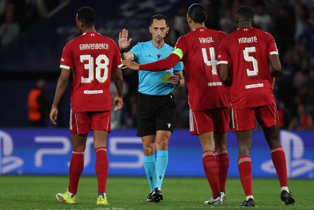 Spanish referee José María Sánchez gestures during the UEFA Champions League quarter-final first leg football match between Paris Saint-Germain (PSG) and Liverpool FC at the Parc des Princes stadium in Paris on April 8, 2026. (Photo by Anne-Christine POUJOULAT / AFP)