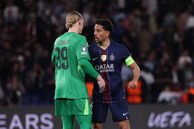 Paris Saint-Germain's Brazilian defender #05 Marquinhos (R) celebrates with Paris Saint-Germain's Russian goalkeeper #39 Matvey Safonov after winning the UEFA Champions League quarter-final first leg football match between Paris Saint-Germain (PSG) and Liverpool FC at the Parc des Princes stadium in Paris on April 8, 2026. (Photo by FRANCK FIFE / AFP)