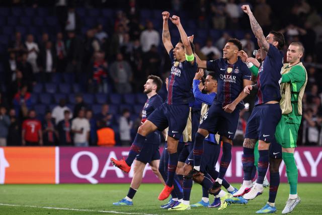 PSG's players celebrate after winning  the UEFA Champions League quarter-final first leg football match between Paris Saint-Germain (PSG) and Liverpool FC at the Parc des Princes stadium in Paris on April 8, 2026. (Photo by FRANCK FIFE / AFP)
