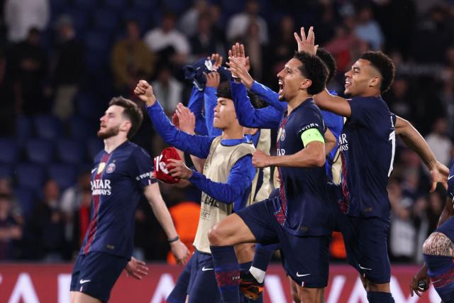 PSG's players celebrate after winning  the UEFA Champions League quarter-final first leg football match between Paris Saint-Germain (PSG) and Liverpool FC at the Parc des Princes stadium in Paris on April 8, 2026. (Photo by FRANCK FIFE / AFP)