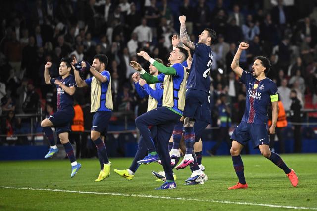Paris' players celebrate their victory at the end of the UEFA Champions League quarter-final first leg football match between Paris Saint-Germain (PSG) and Liverpool FC at the Parc des Princes stadium in Paris on April 8, 2026. (Photo by JULIEN DE ROSA / AFP)