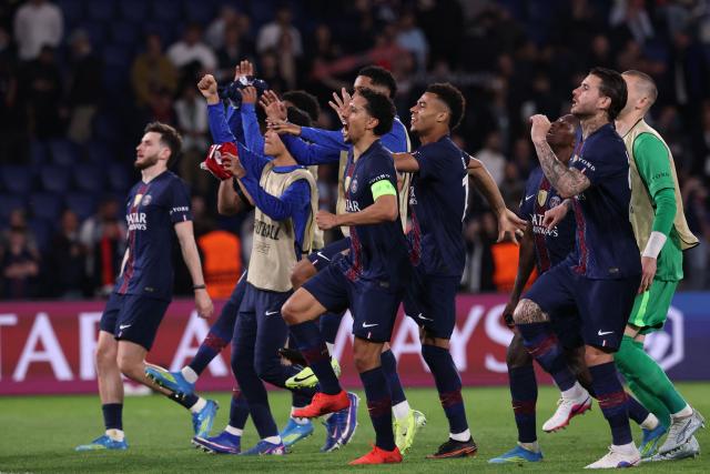 PSG's players celebrate after winning  the UEFA Champions League quarter-final first leg football match between Paris Saint-Germain (PSG) and Liverpool FC at the Parc des Princes stadium in Paris on April 8, 2026. (Photo by FRANCK FIFE / AFP)
