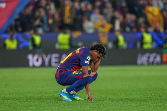 Barcelona's Spanish forward #10 Lamine Yamal reacts after the UEFA Champions League quarter final first leg football match between FC Barcelona and Club Atletico de Madrid at Camp Nou Stadium in Barcelona on April 8, 2026. (Photo by Lluis GENE / AFP)