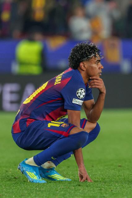 Barcelona's Spanish forward #10 Lamine Yamal reacts after the UEFA Champions League quarter final first leg football match between FC Barcelona and Club Atletico de Madrid at Camp Nou Stadium in Barcelona on April 8, 2026. (Photo by Lluis GENE / AFP)