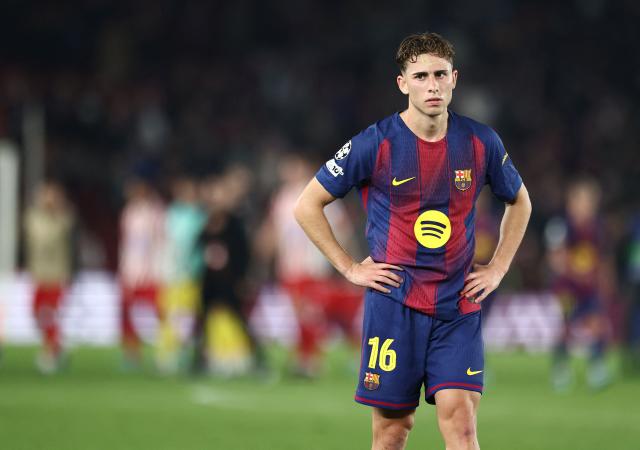 Barcelona's Spanish midfielder #16 Fermin Lopez reacts at the end of the UEFA Champions League quarter final first leg football match between FC Barcelona and Club Atletico de Madrid at Camp Nou Stadium in Barcelona on April 8, 2026. Atletico Madrid won 0-2. (Photo by Josep LAGO / AFP)