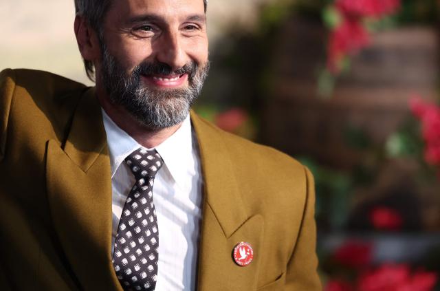 Italian playwright Marco Calvani wears an Artists4Ceasefire pin as he attends Universal's premiere of "You, Me & Tuscany" at Jazz at Lincoln Center in New York on April 8, 2026. (Photo by CHARLY TRIBALLEAU / AFP)