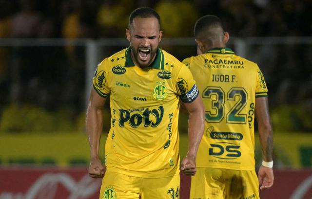 Mirassol's defender #34 Joao Victor (L) celebrates next to teammate defender #32 Igor Formiga after scoring his team's first goal during the Copa Libertadores group stage football match between Brazil's Mirassol and Argentina's Lanus at the Jose Maria de Campos Maia stadium in Mirassol, state of Sao Paulo, Brazil, on April 8, 2026. (Photo by NELSON ALMEIDA / AFP)