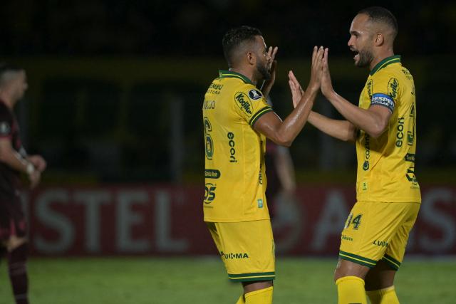 Mirassol's defender #34 Joao Victor (R) celebrates with teammate defender #06 Reinaldo after scoring his team's first goal during the Copa Libertadores group stage football match between Brazil's Mirassol and Argentina's Lanus at the Jose Maria de Campos Maia stadium in Mirassol, state of Sao Paulo, Brazil, on April 8, 2026. (Photo by NELSON ALMEIDA / AFP)