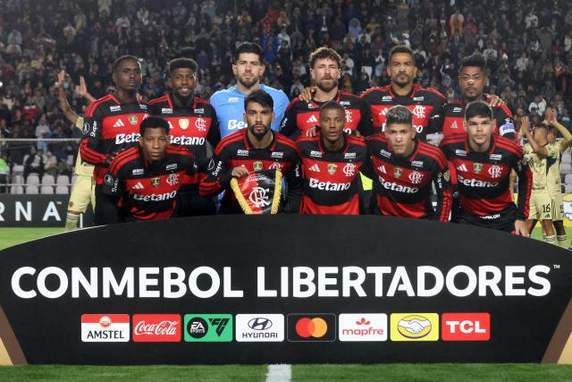 Flamengo players pose for a team photo ahead of the Copa Libertadores group stage football match between Peru's Cusco FC and Brazil's Flamengo at the Inca Garcilaso de la Vega stadium in Cusco, Peru, on April 8, 2026. (Photo by Diego RAMOS / AFP)