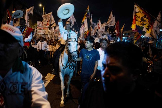 Peru's presidential candidate Roberto Sanchez, for the Juntos por el Peru party, gestures upon arrival at his closing campaign rally at 2 de Mayo Square in Lima on April 8, 2026. Peru will hold presidential elections on April 12. (Photo by Ernesto BENAVIDES / AFP)