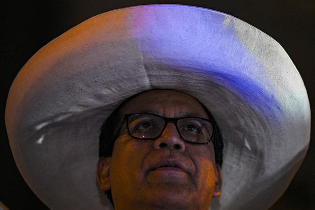 Peru's presidential candidate Roberto Sanchez, for the Juntos por el Peru party, looks on during his closing campaign rally at 2 de Mayo Square in Lima on April 8, 2026. Peru will hold presidential elections on April 12. (Photo by Ernesto BENAVIDES / AFP)