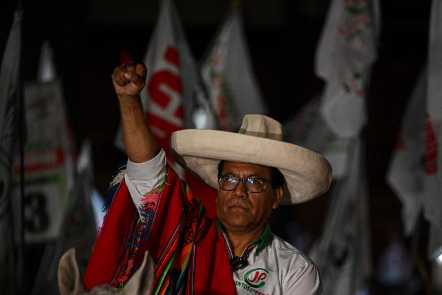 Peru's presidential candidate Roberto Sanchez, for the Juntos por el Peru party, gestures upon arrival at his closing campaign rally at 2 de Mayo Square in Lima on April 8, 2026. Peru will hold presidential elections on April 12. (Photo by Ernesto BENAVIDES / AFP)