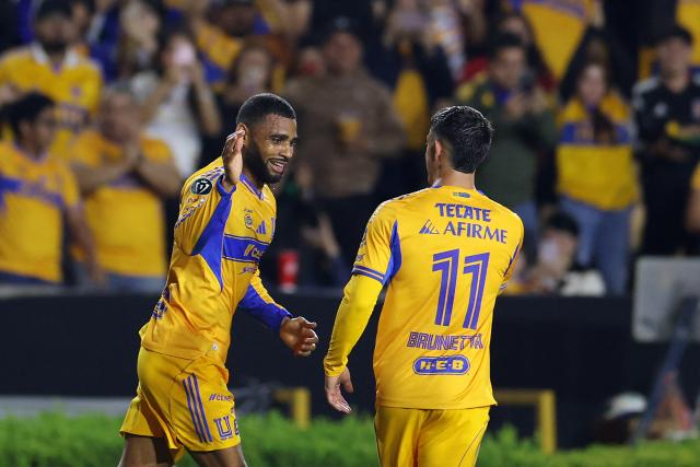 Tigres' Brazilian defender #28 Joaquim Henrique and teammate Argentine midfielder #11 Juan Brunetta celebrate after an own goal scored by Seattle Sounders' defender #25 Jackson Ragen (out of frame) during the CONCACAF Champions Cup quarterfinal football match between Mexico's Tigres and US' Seattle Sounders at the Universitario stadium in San Nicolas de los Garza, state of Nuevo Leon, Mexico on April 8, 2026. (Photo by Julio Cesar AGUILAR / AFP)