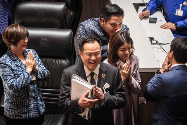 Thailand's Prime Minister Anutin Charnvirakul (C) arrives before delivering the cabinet policy speech at the parliament chamber in Bangkok on April 9, 2026. (Photo by chanakarn LAOSARAKHAM / AFP)