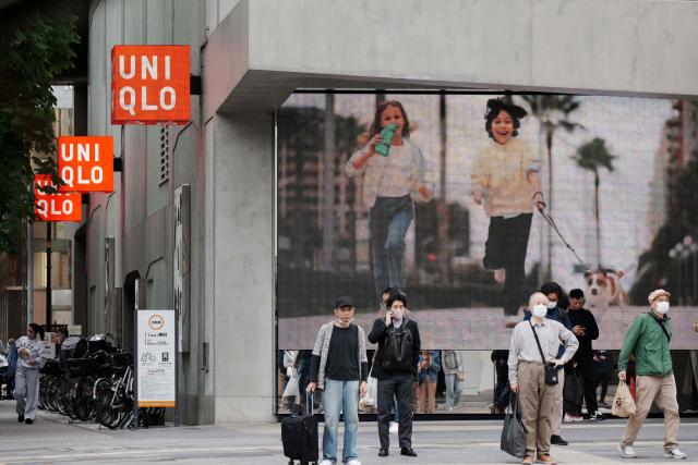 The logo of the Fast Retailing clothing brand Uniqlo is seen outside a branch in central Tokyo on April 9, 2026. (Photo by Kazuhiro NOGI / AFP)