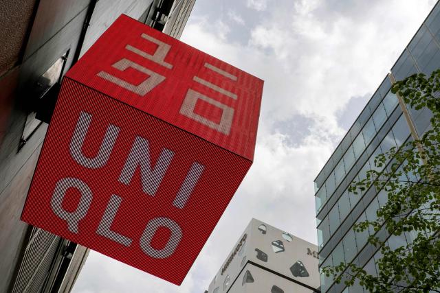 The logo of the Fast Retailing clothing brand Uniqlo is seen outside a branch in central Tokyo on April 9, 2026. (Photo by Kazuhiro NOGI / AFP)
