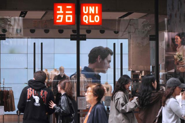 The logo of the Fast Retailing clothing brand Uniqlo is seen outside a branch in central Tokyo on April 9, 2026. (Photo by Kazuhiro NOGI / AFP)